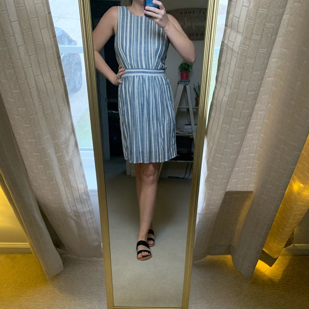 Blue and white striped mini dress with open, bow-tie back.